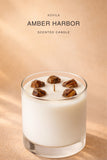 AOVILA Amber Harbor candle styled for a warm woods home fragrance mood with golden amber and sandalwood notes