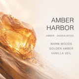 AOVILA Amber Harbor scent note chart showing warm woods, golden amber, vanilla veil, amber, and sandalwood