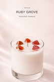 AOVILA Ruby Grove candle styled for a soft fruity floral home fragrance mood with apple, jasmine, and musk notes